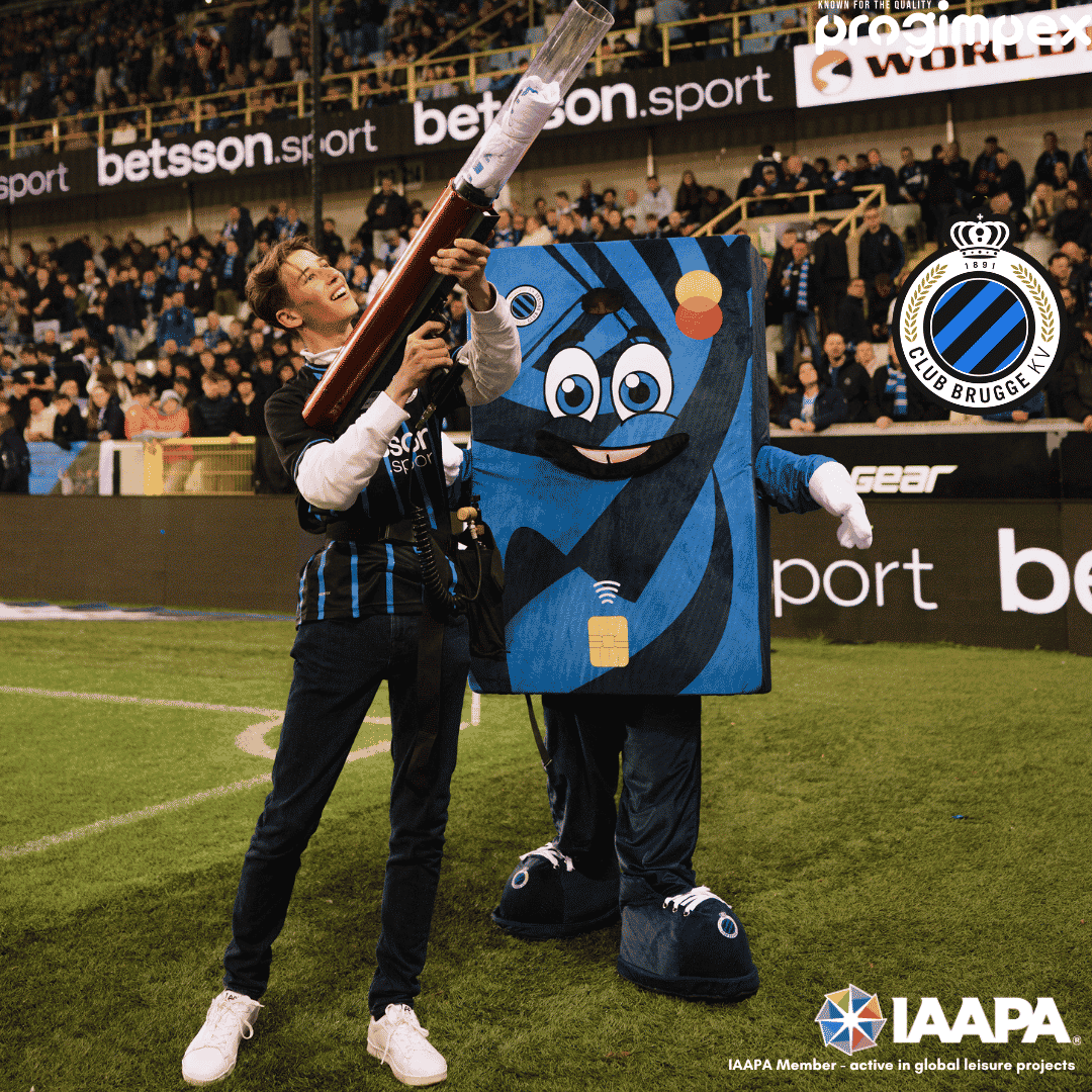 Payman, the Club Pay mascot costume made by Progimpex for Club Brugge, on the pitch with supporters.