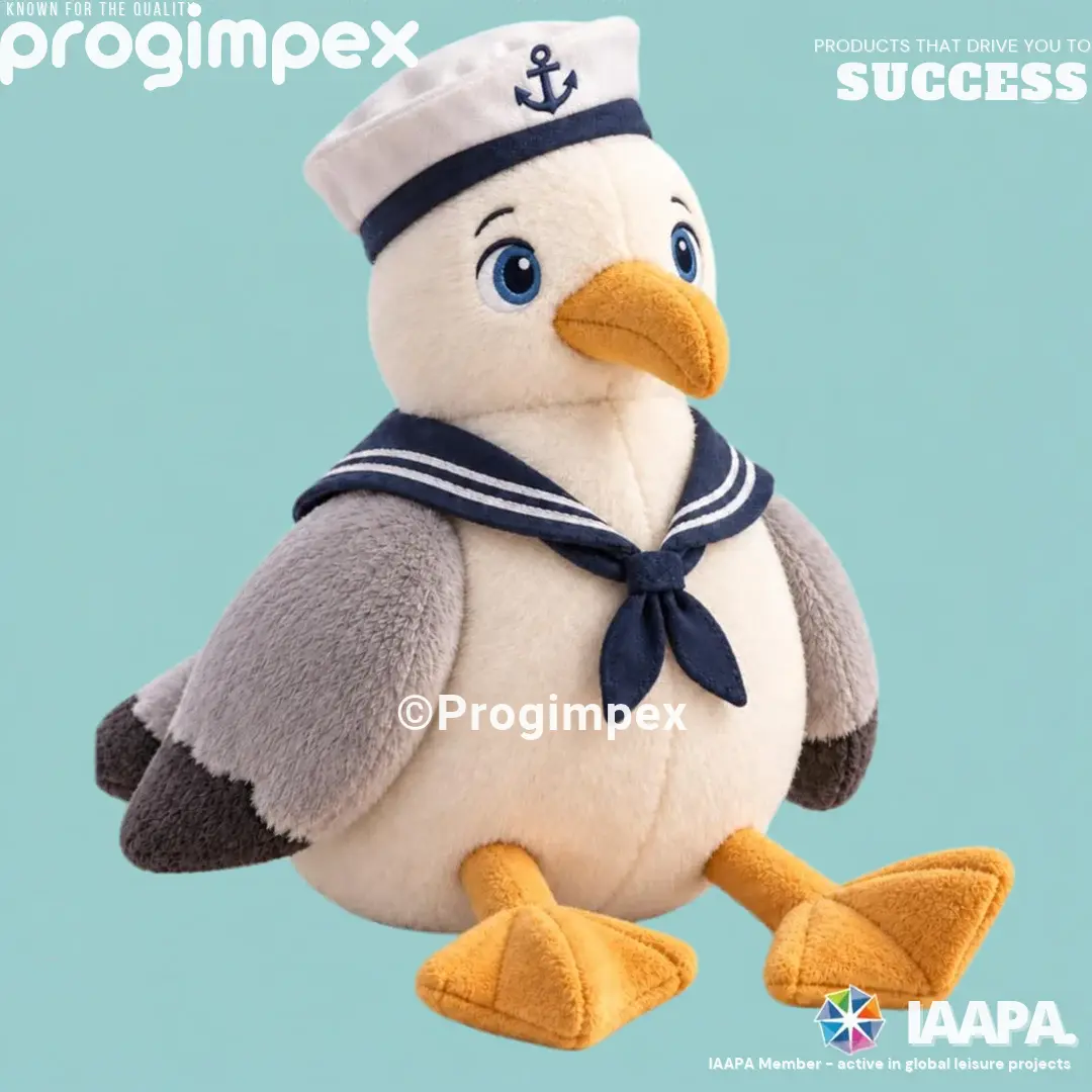Custom nautical seagull plush toy with embroidered blue eyes, a navy sailor collar and an embroidered anchor on its sailor cap.