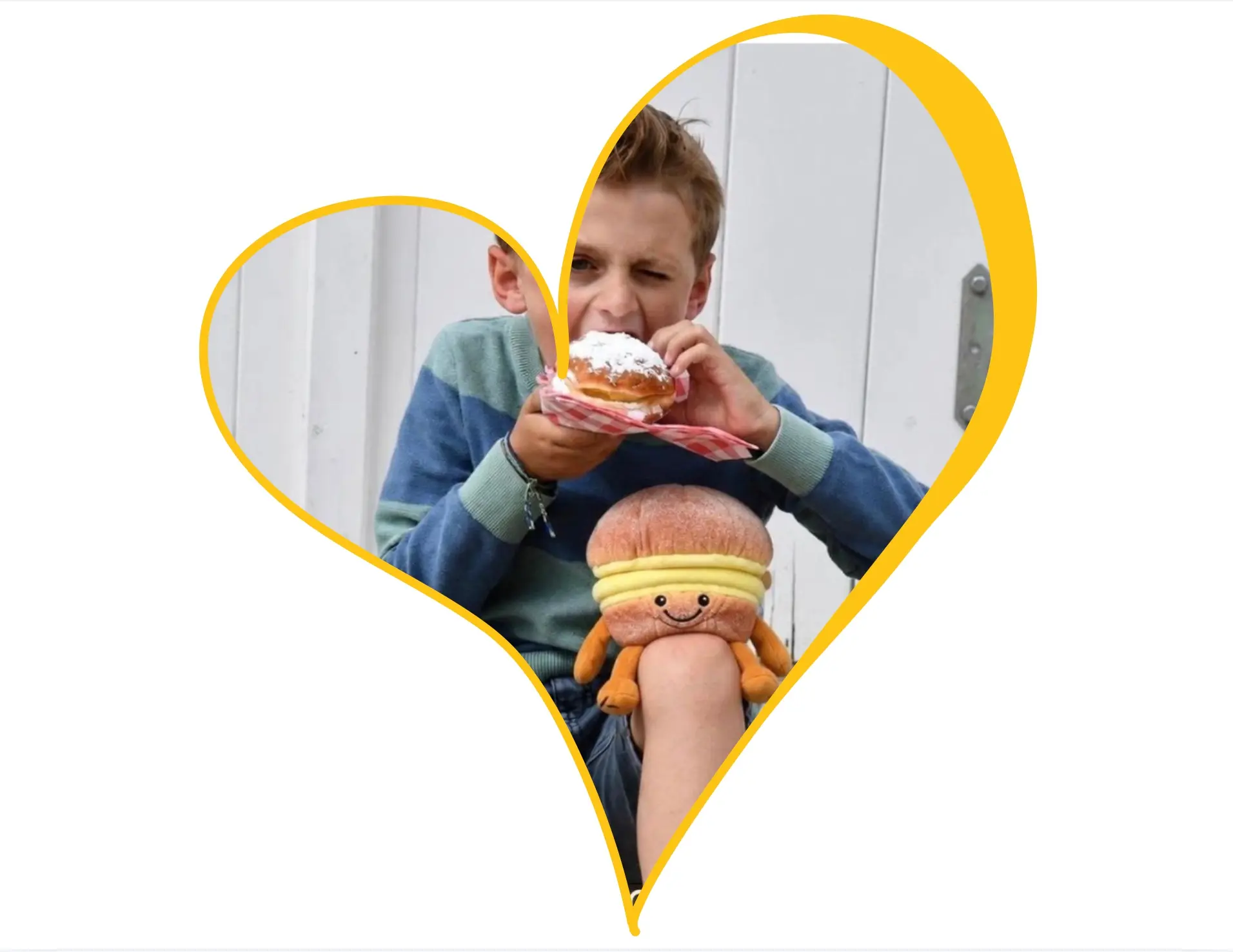 Boy eating a boule de Berlin with the custom boule de Berlin plush toy made by Progimpex for the municipality of Knokke-Heist on his knee. Photo Boy eating a boule de Berlin with the custom boule de Berlin plush toy made by Progimpex for the municipality of Knokke-Heist on his knee. Photo ©Knokke-Heist
